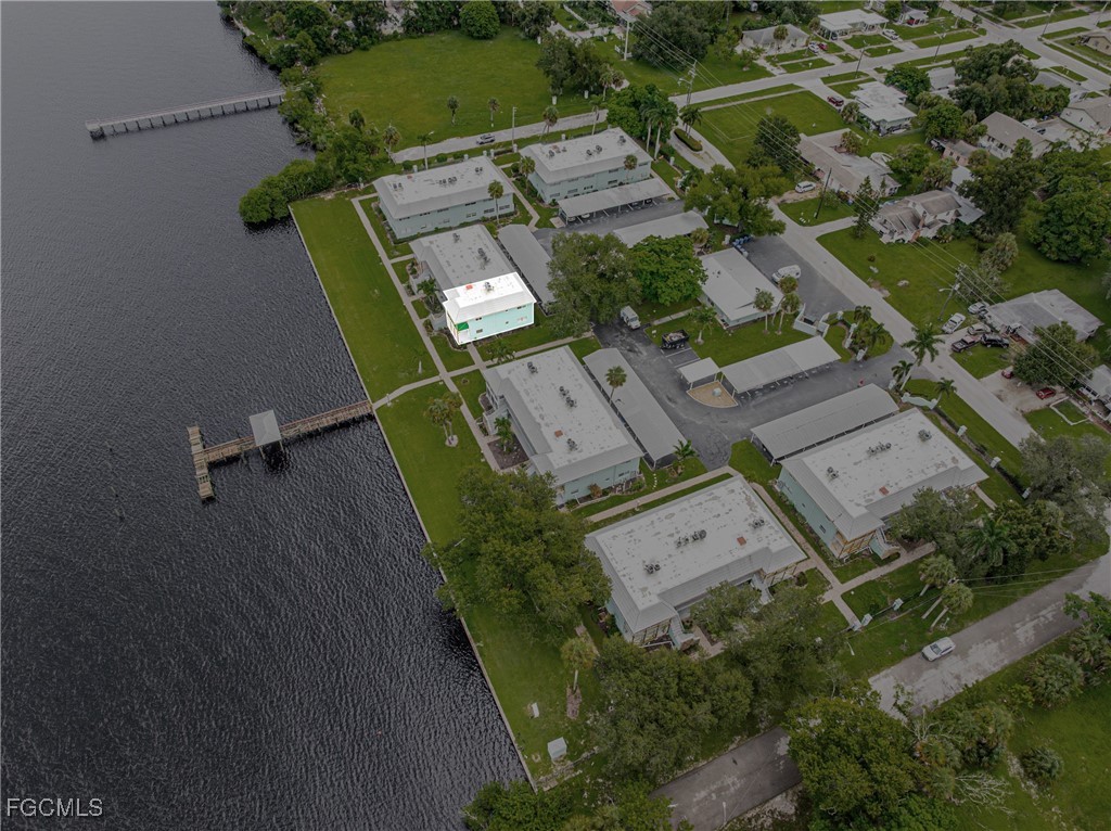 3225 East Riverside Drive, Unit 34C Fort Myers, FL 33916 - Photo 49 of 50 an aerial view of a residential houses with outdoor space and parking