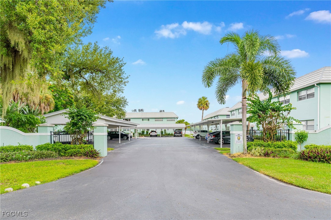 3225 East Riverside Drive, Unit 34C Fort Myers, FL 33916 - Photo 6 of 50 a view of a house with a yard and sitting area