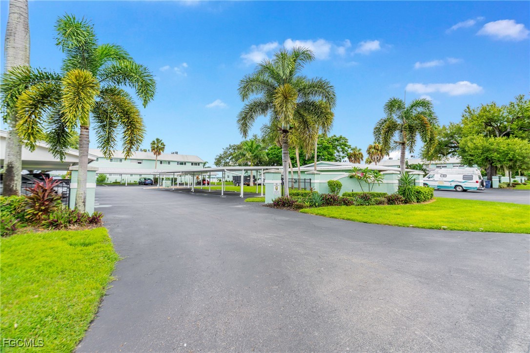 3225 East Riverside Drive, Unit 34C Fort Myers, FL 33916 - Photo 9 of 50 a view of swimming pool with outdoor seating and yard