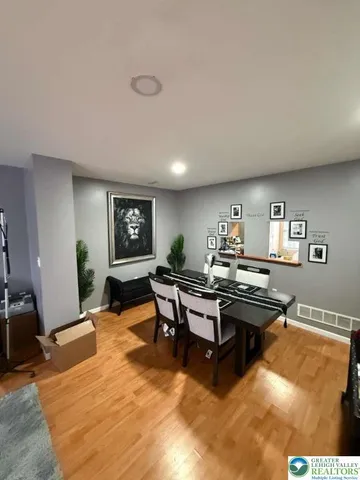 a living room with furniture a rug and a table