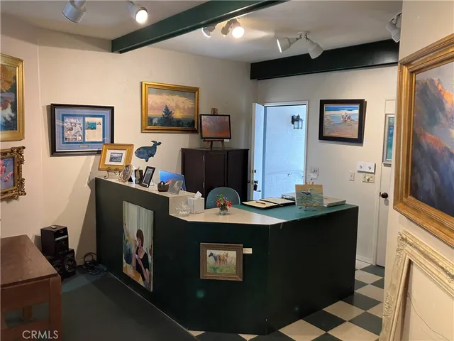 a view of a living room with furniture and a flat screen tv