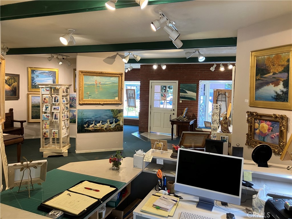 724 Main Street Cambria, CA 93428 - Photo 17 of 24 a living room with furniture and a flat screen tv