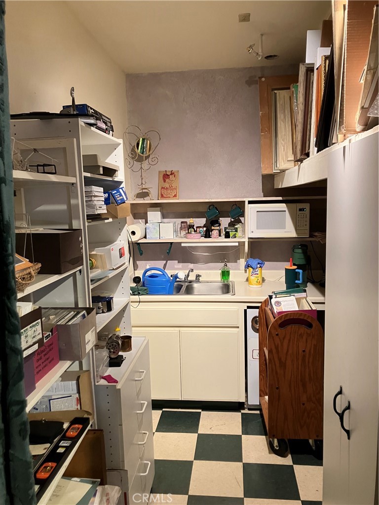 724 Main Street Cambria, CA 93428 - Photo 18 of 24 a room with storage and utility