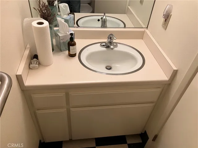a bathroom with a sink and mirror