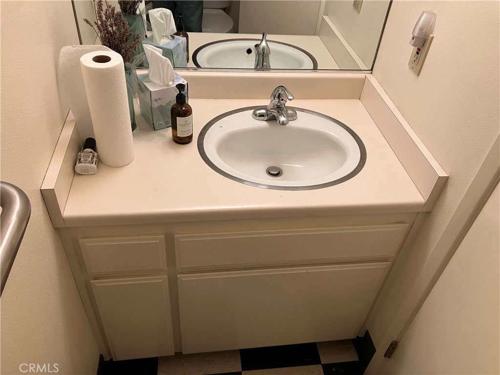 724 Main Street Cambria, CA 93428 - Photo 20 of 24 a bathroom with a sink and mirror