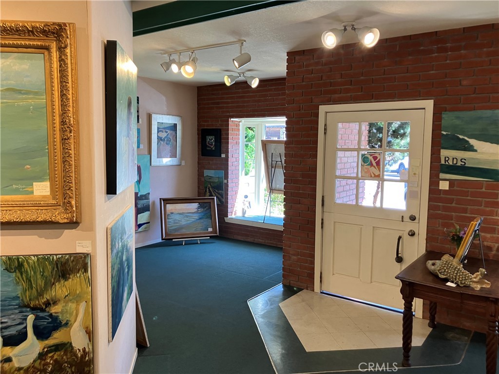 724 Main Street Cambria, CA 93428 - Photo 5 of 24 a view of a livingroom with furniture and windows