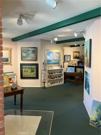 a kitchen with stainless steel appliances dining table and chairs