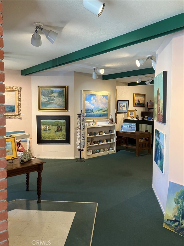 724 Main Street Cambria, CA 93428 - Photo 6 of 24 a kitchen with stainless steel appliances dining table and chairs