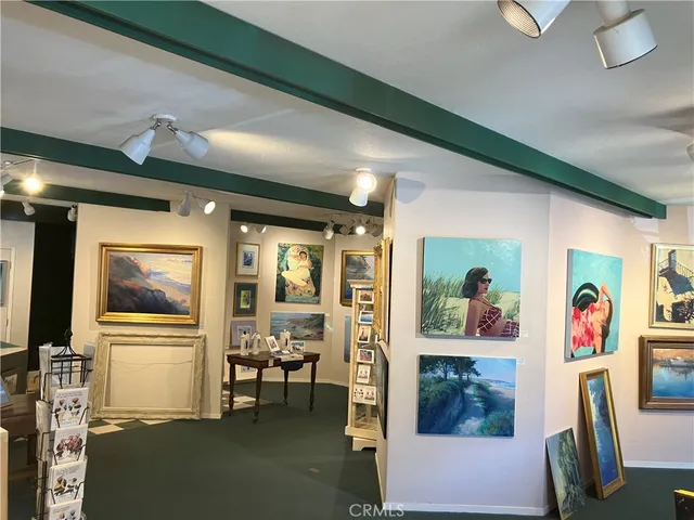 a view of a livingroom with furniture hardwood floor and furniture