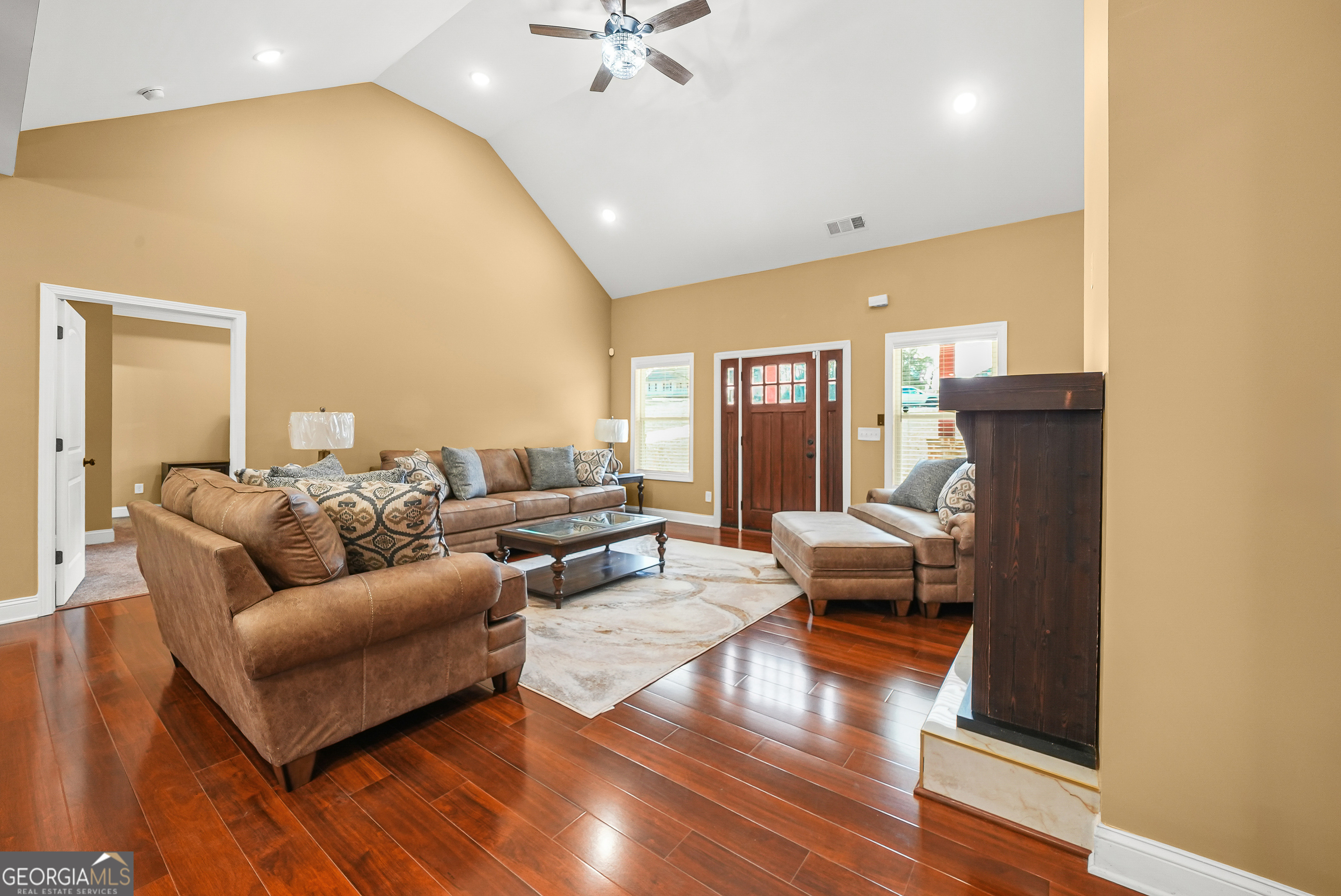 1663 Piedmont Road Griffin, GA 30224 - Photo 11 of 35 a living room with furniture and a wooden floor