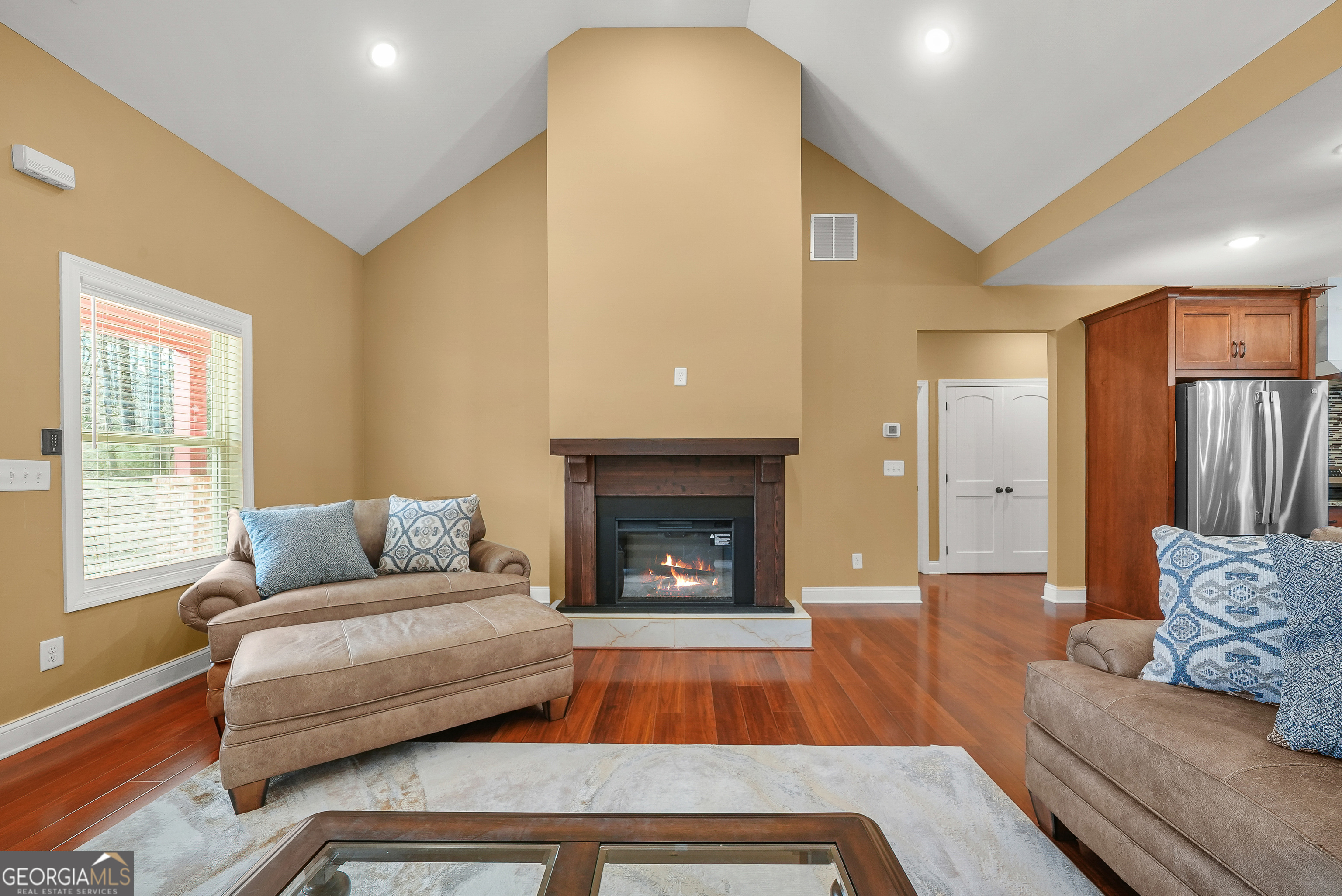 1663 Piedmont Road Griffin, GA 30224 - Photo 12 of 35 a living room with furniture and a fireplace