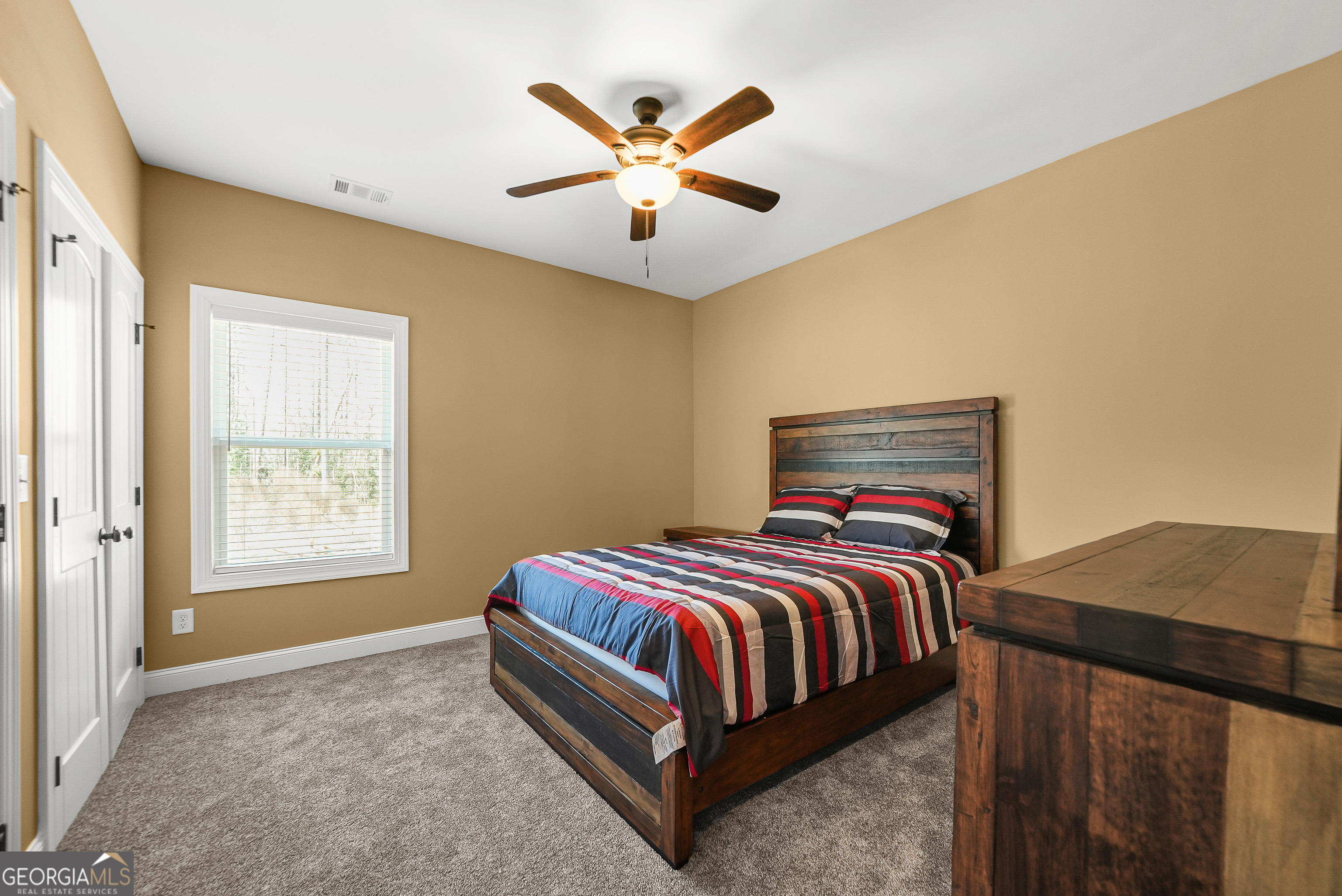 1663 Piedmont Road Griffin, GA 30224 - Photo 20 of 35 a bedroom with a bed and window