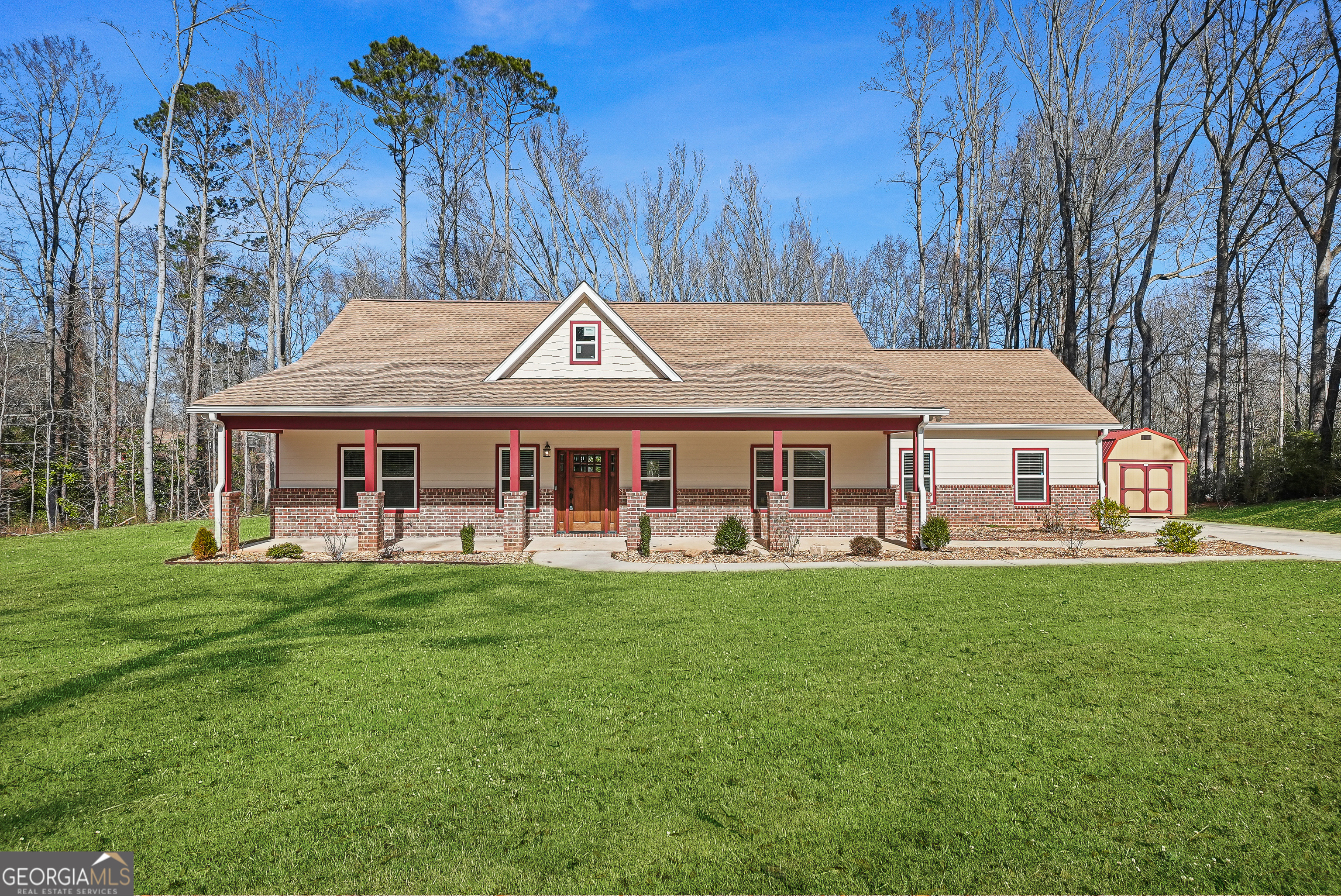 1663 Piedmont Road Griffin, GA 30224 - Photo 2 of 35 a front view of a house with garden