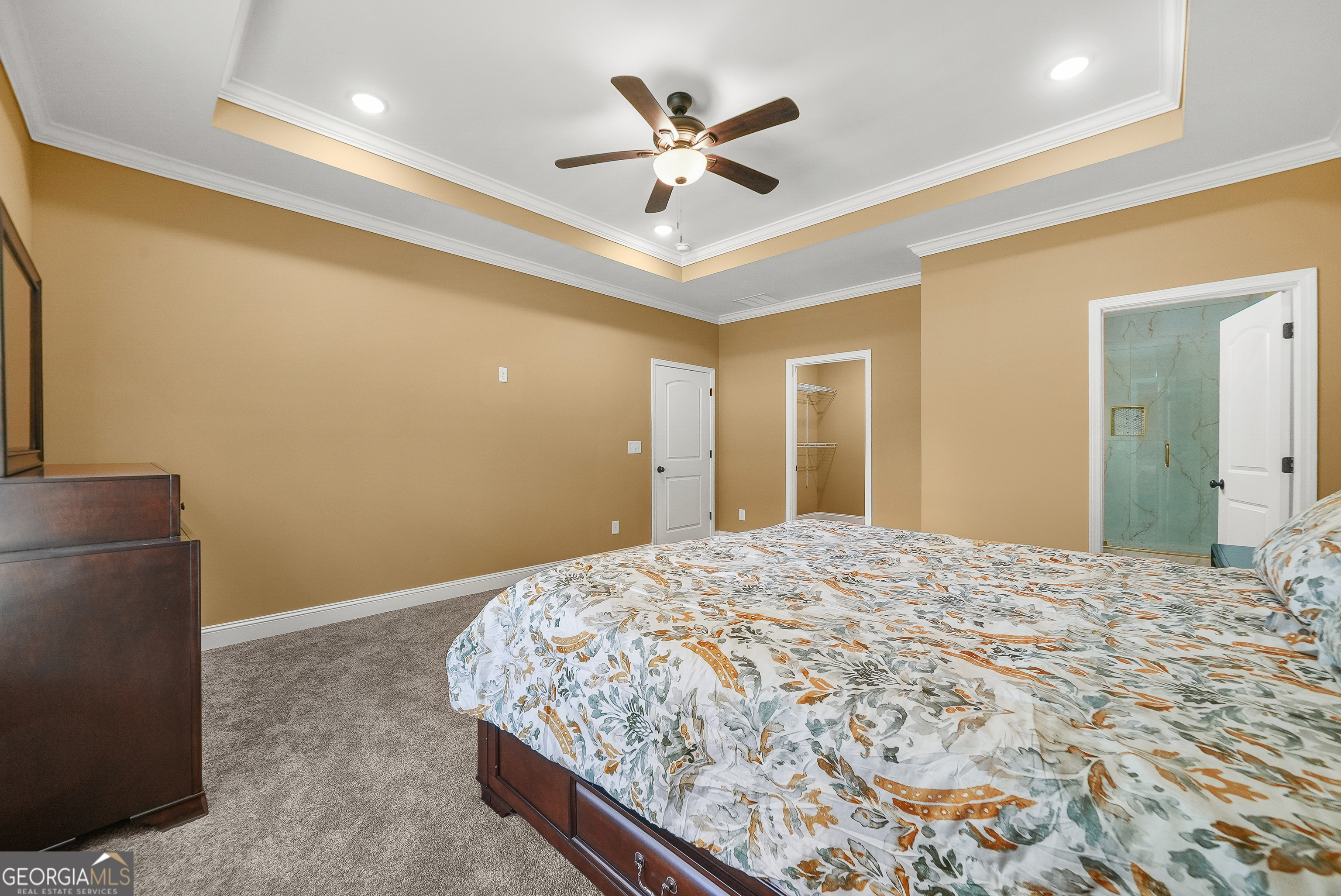 1663 Piedmont Road Griffin, GA 30224 - Photo 22 of 35 a bedroom with a bed and a ceiling fan