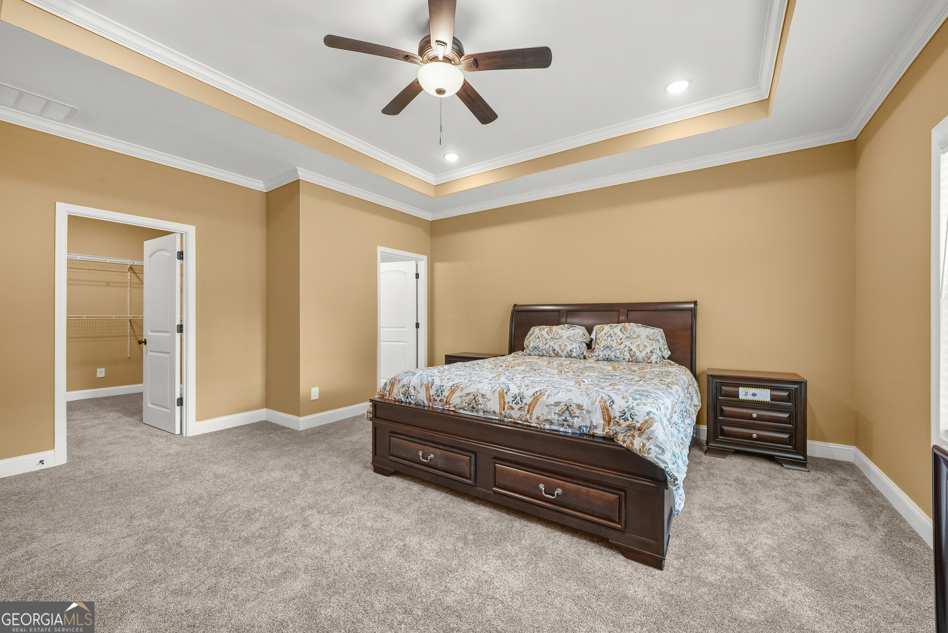 1663 Piedmont Road Griffin, GA 30224 - Photo 25 of 35 a spacious bedroom with a bed and ceiling fan