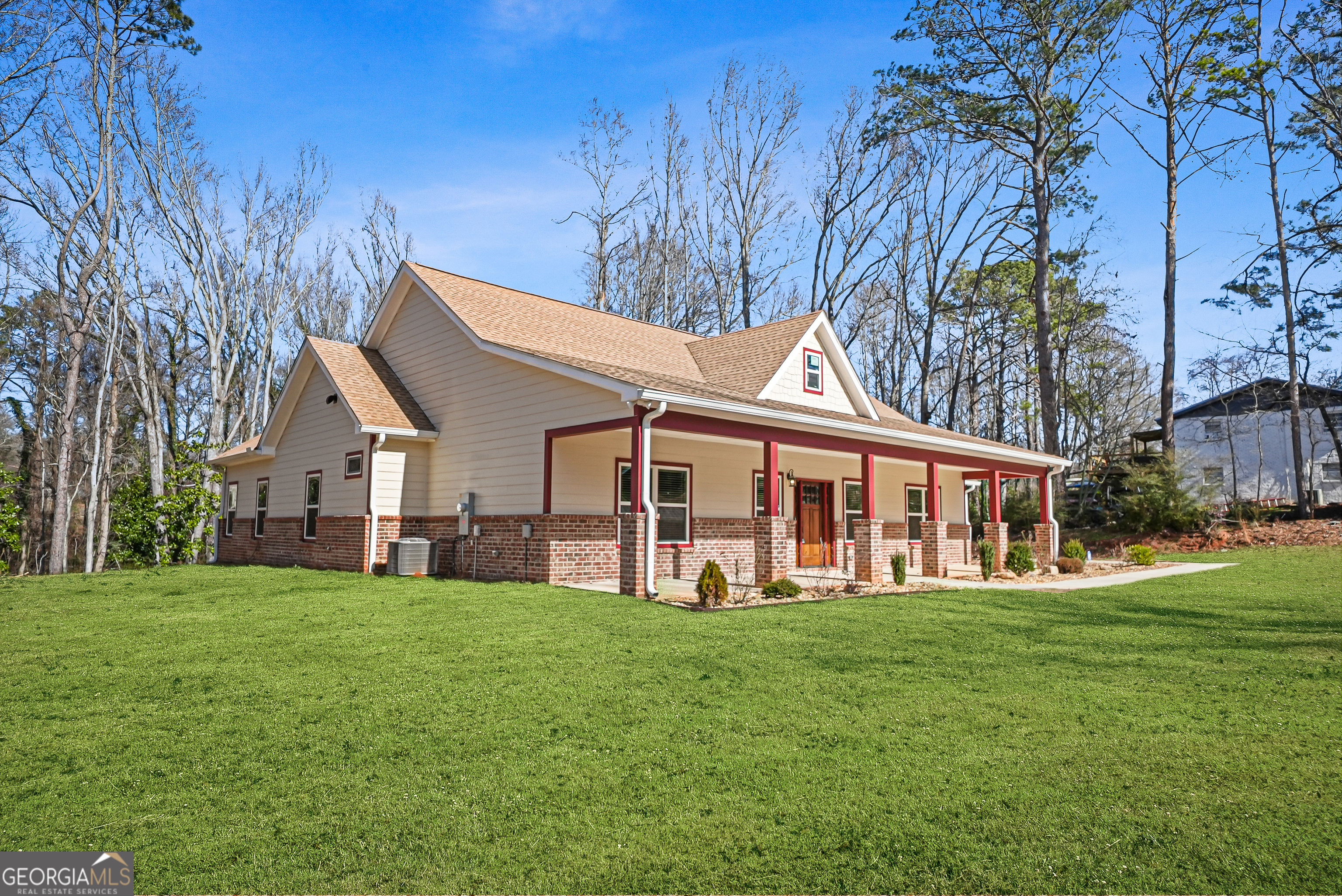 1663 Piedmont Road Griffin, GA 30224 - Photo 5 of 35 a front view of a house with a yard