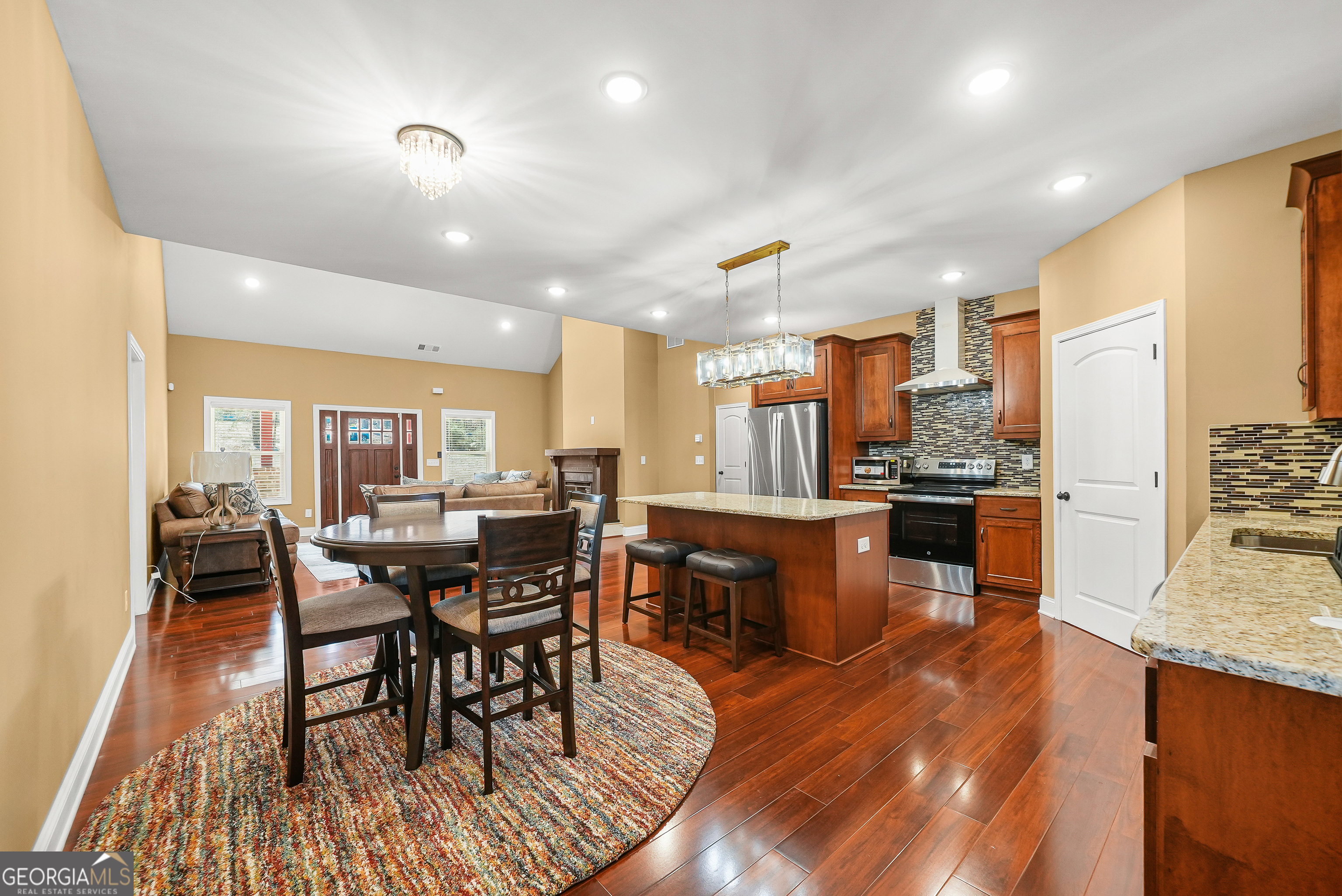 1663 Piedmont Road Griffin, GA 30224 - Photo 10 of 35 a kitchen with lots of counter top space and stainless steel appliances
