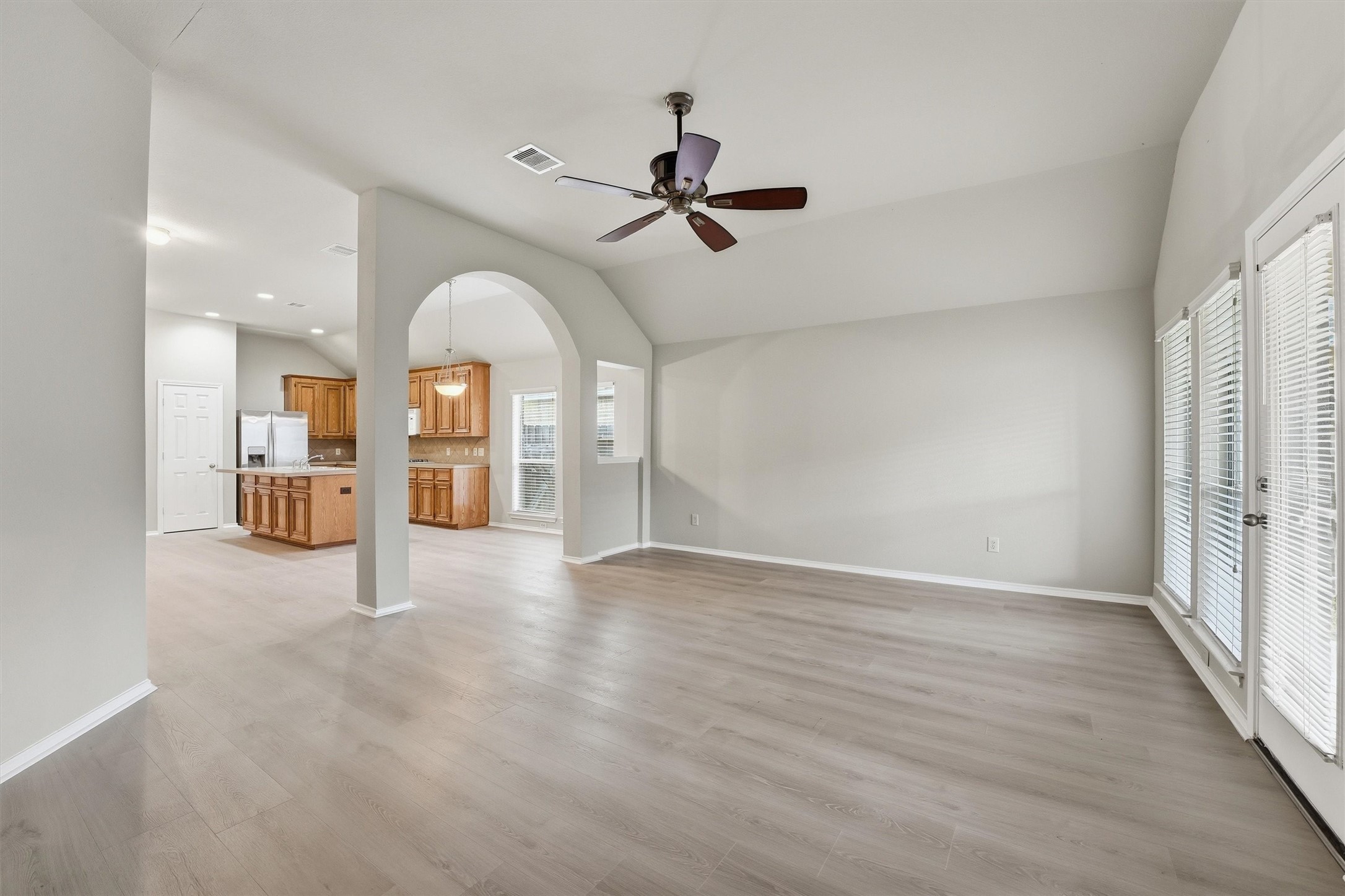 20931 Hamlet Ridge Lane Katy, TX 77449 - Photo 12 of 23 Living room leads to a lovely covered patio and backyard.