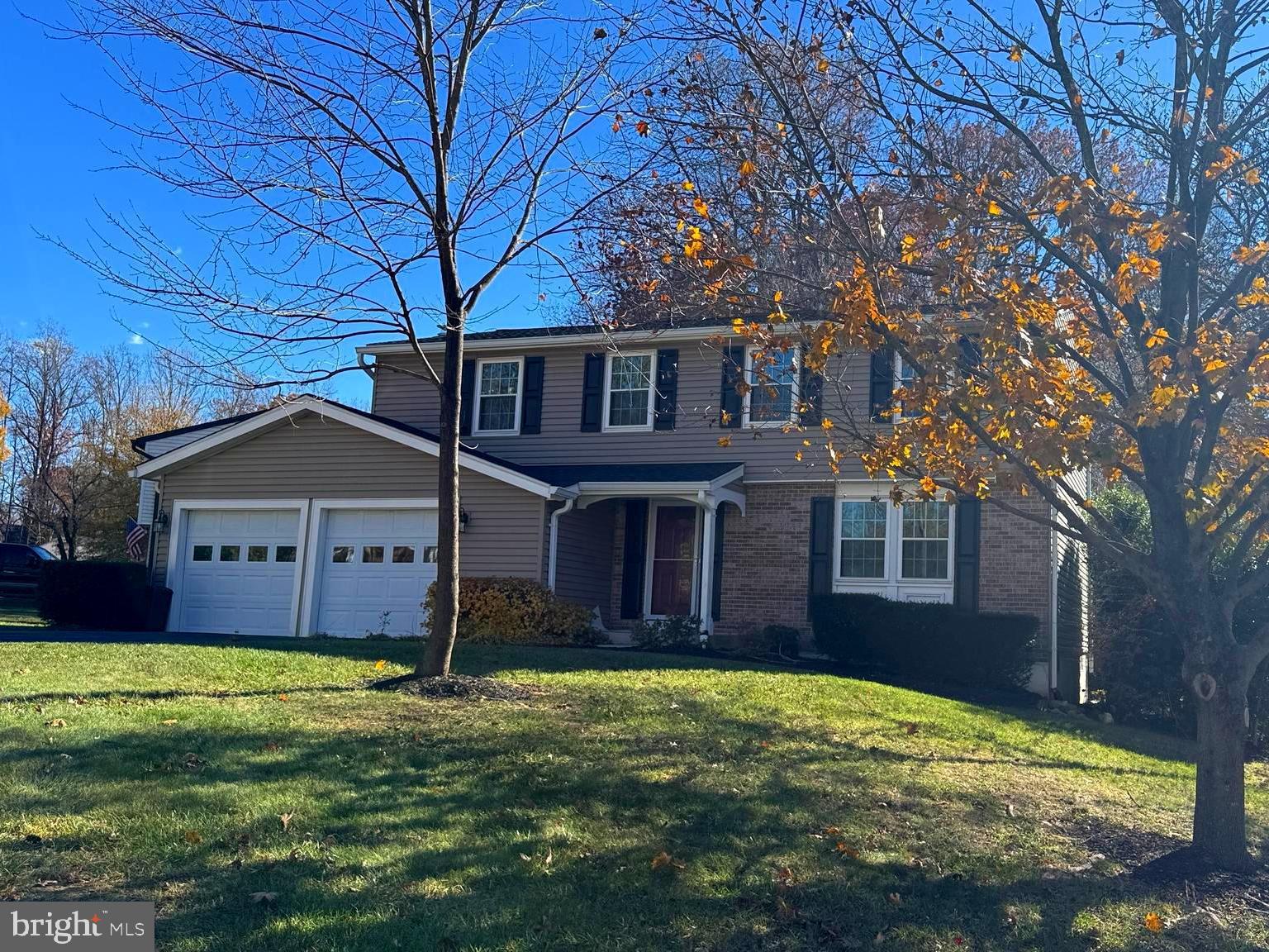 8375 Magic Leaf Road Springfield, VA 22153 - Photo 1 of 43 a front view of a house with a yard