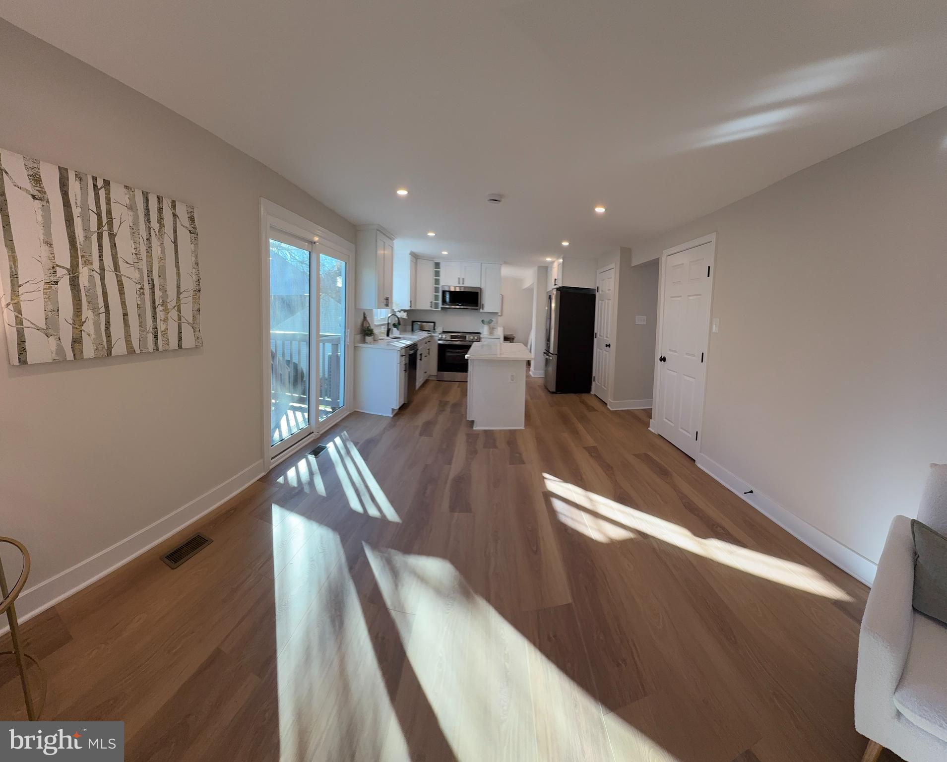 8375 Magic Leaf Road Springfield, VA 22153 - Photo 10 of 43 a view of a living room and dining room