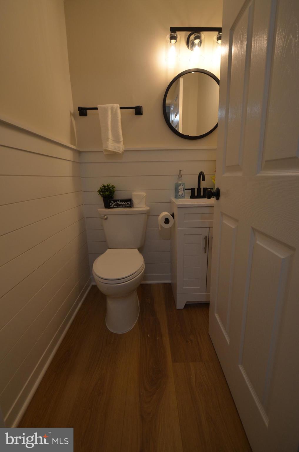 8375 Magic Leaf Road Springfield, VA 22153 - Photo 12 of 43 a bathroom with a toilet and a mirror