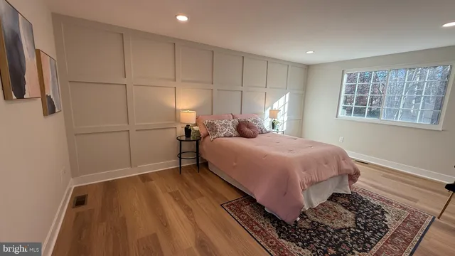a bed room with a bed and a window