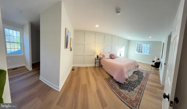 a bed room with a bed and a chair