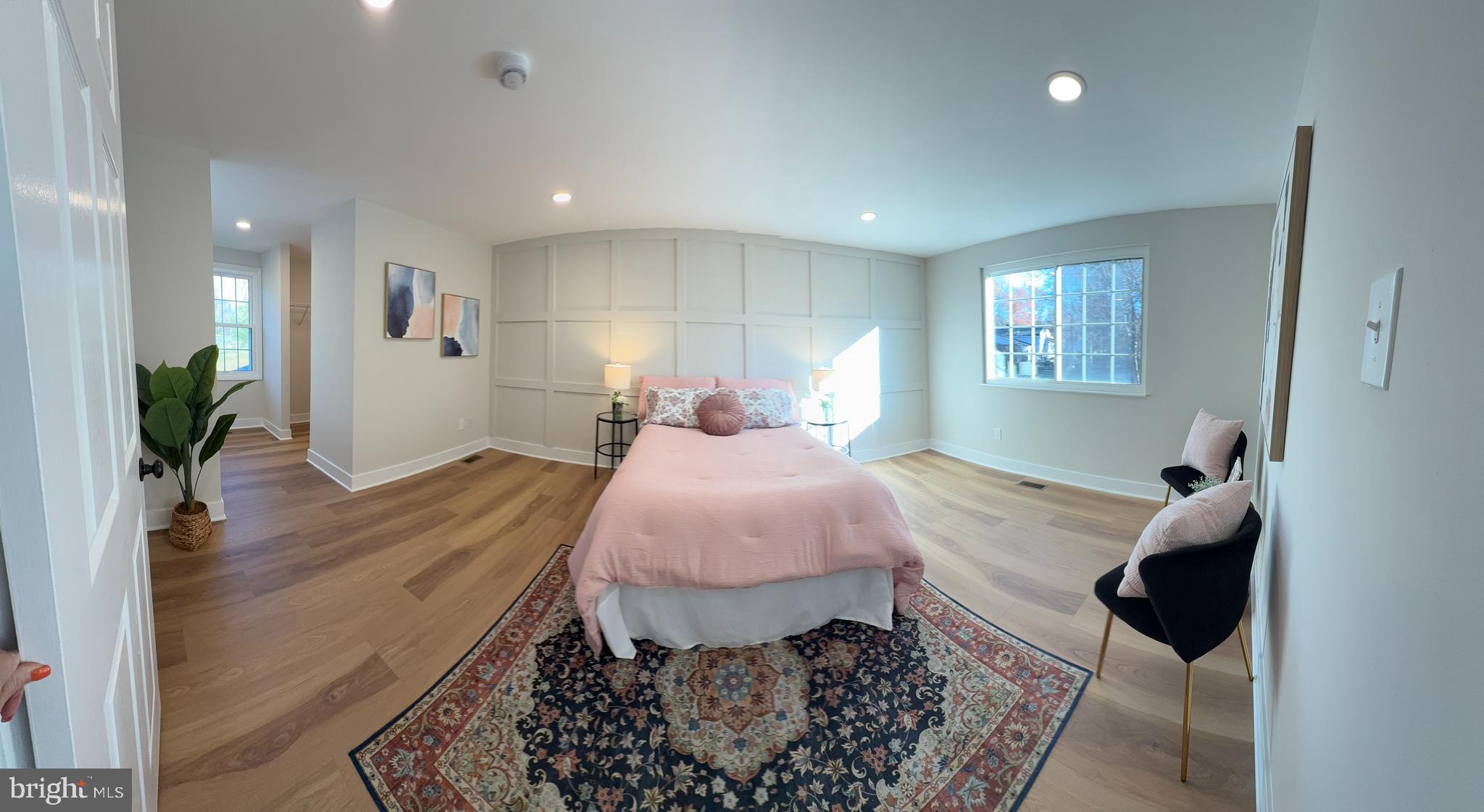 8375 Magic Leaf Road Springfield, VA 22153 - Photo 20 of 43 a spacious bedroom with a bed and wooden floor