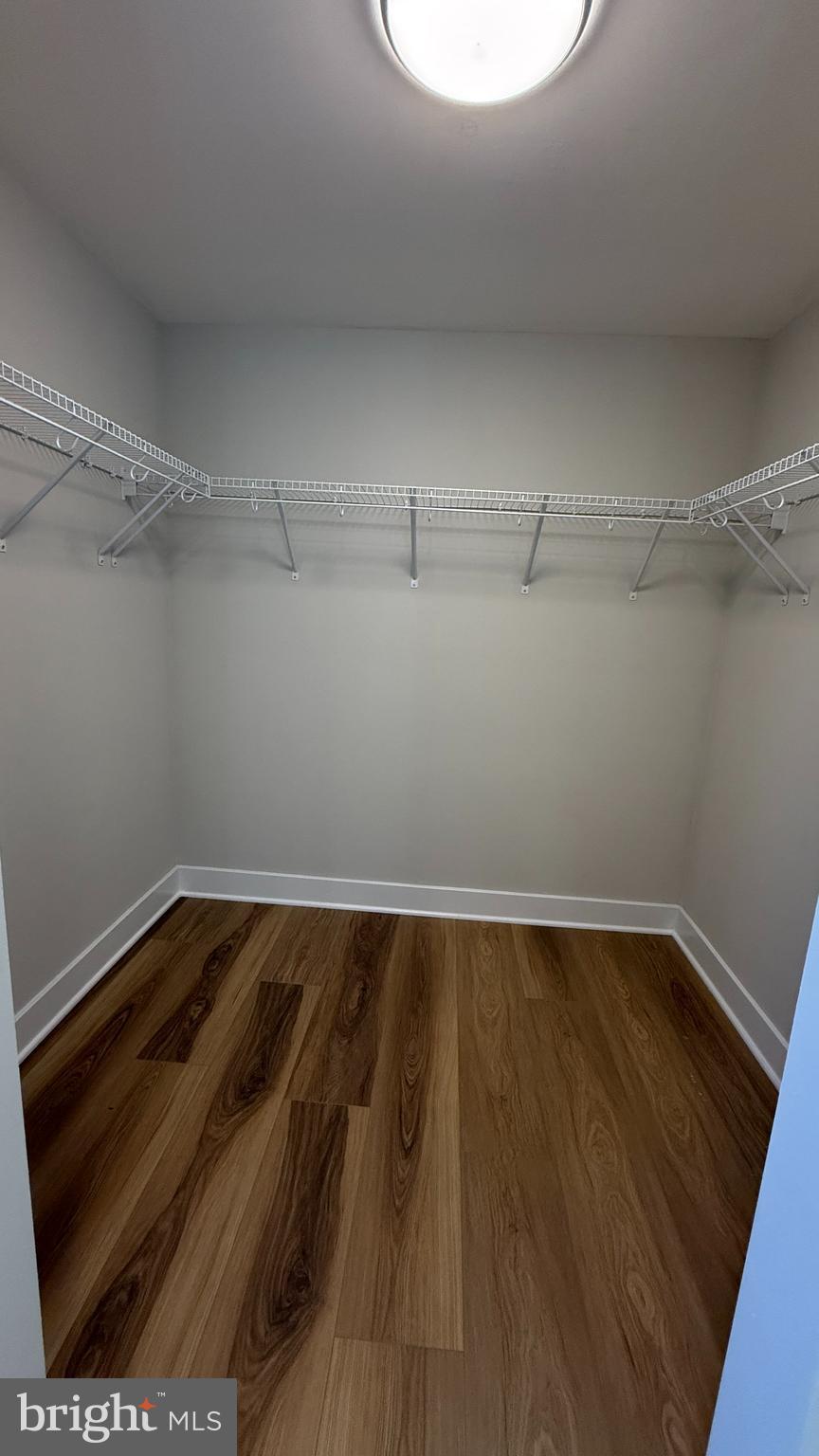 8375 Magic Leaf Road Springfield, VA 22153 - Photo 23 of 43 a view of a room with wooden floor