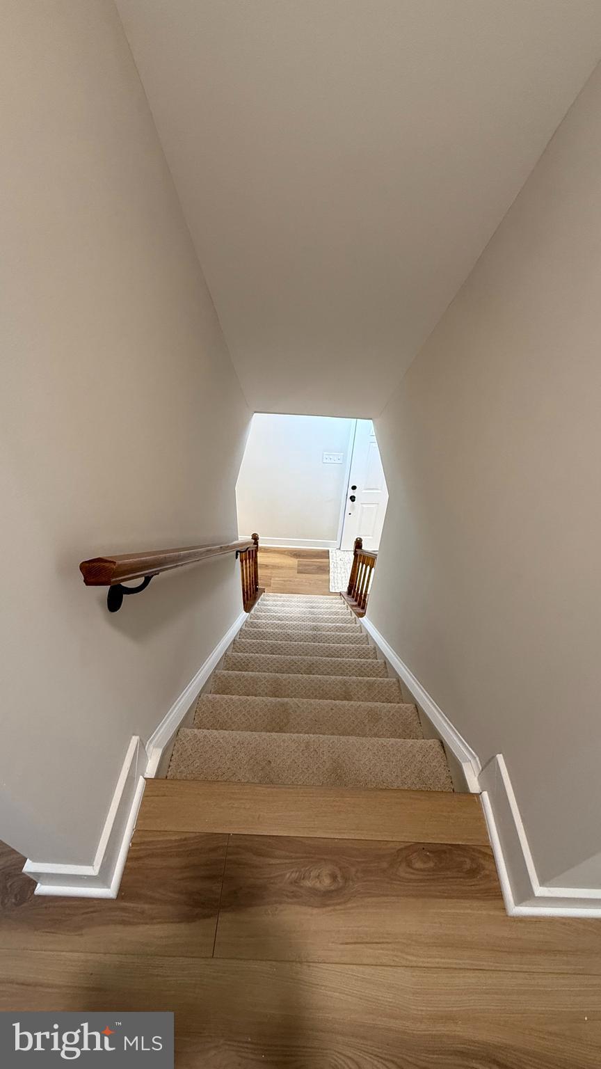 8375 Magic Leaf Road Springfield, VA 22153 - Photo 25 of 43 a bedroom with a bed and wooden floor