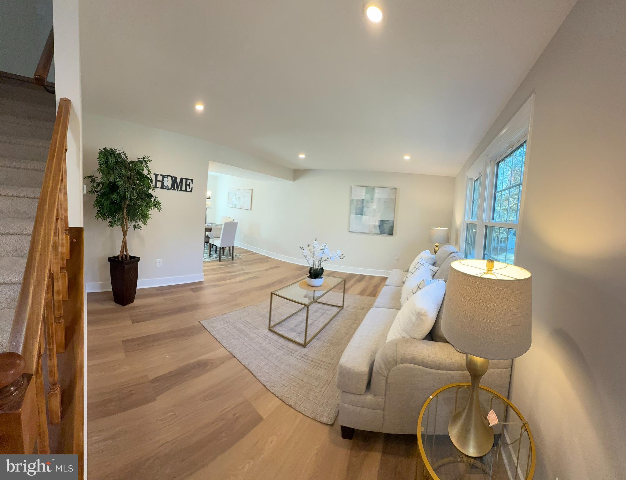 8375 Magic Leaf Road Springfield, VA 22153 - Photo 26 of 43 a living room with furniture and a potted plant