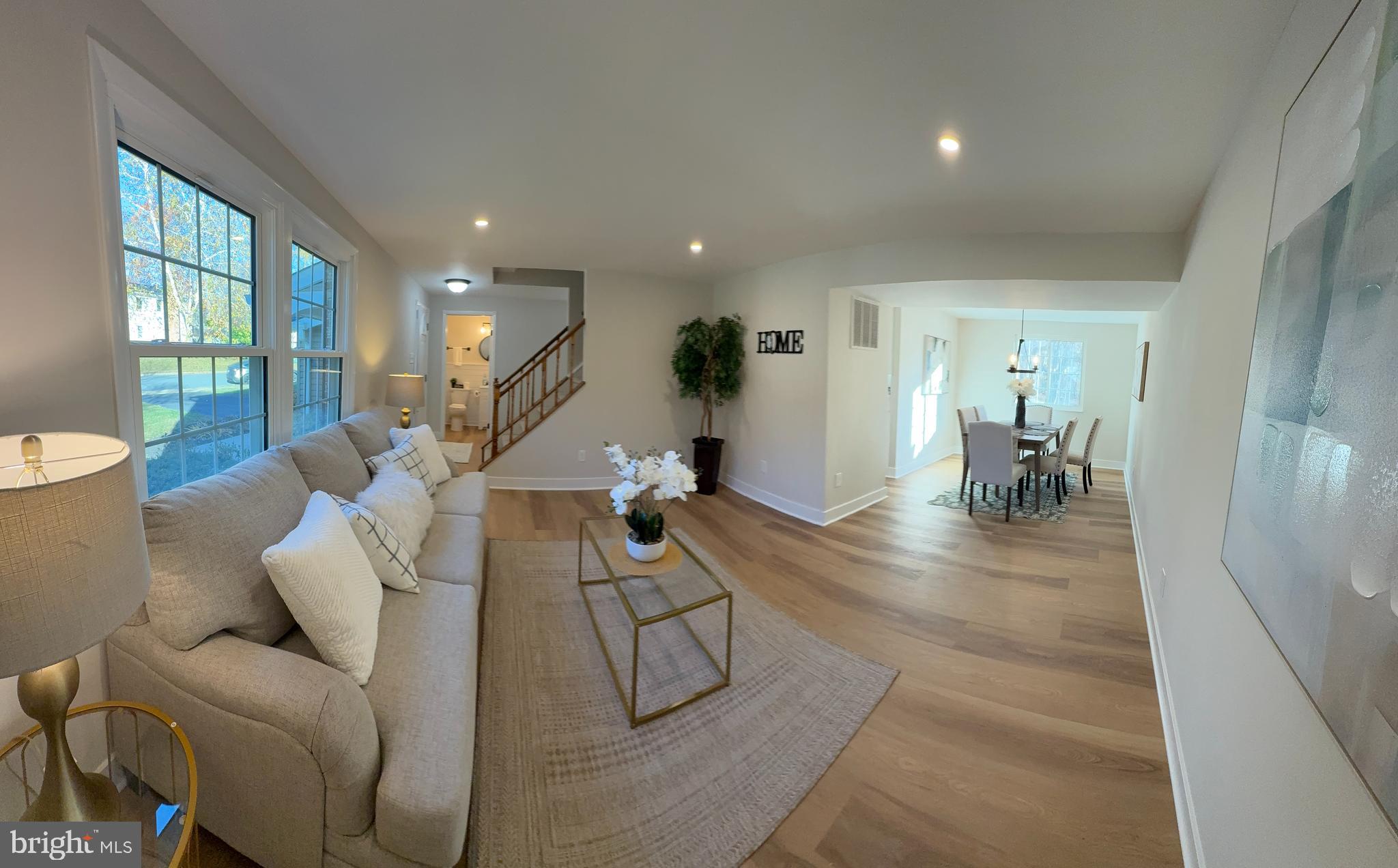 8375 Magic Leaf Road Springfield, VA 22153 - Photo 27 of 43 a living room with furniture and a table