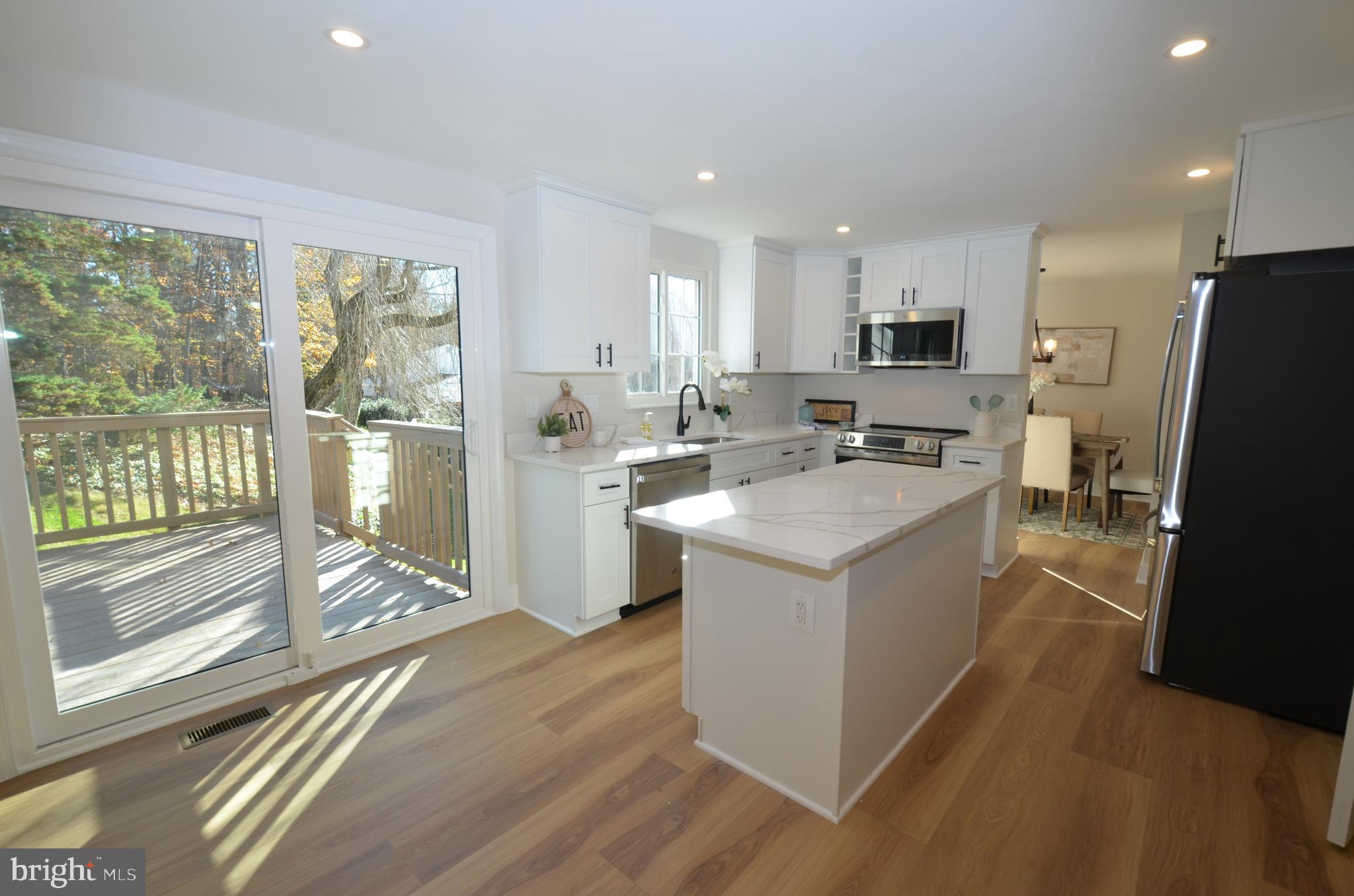 8375 Magic Leaf Road Springfield, VA 22153 - Photo 28 of 43 a view of kitchen with sink and refrigerator