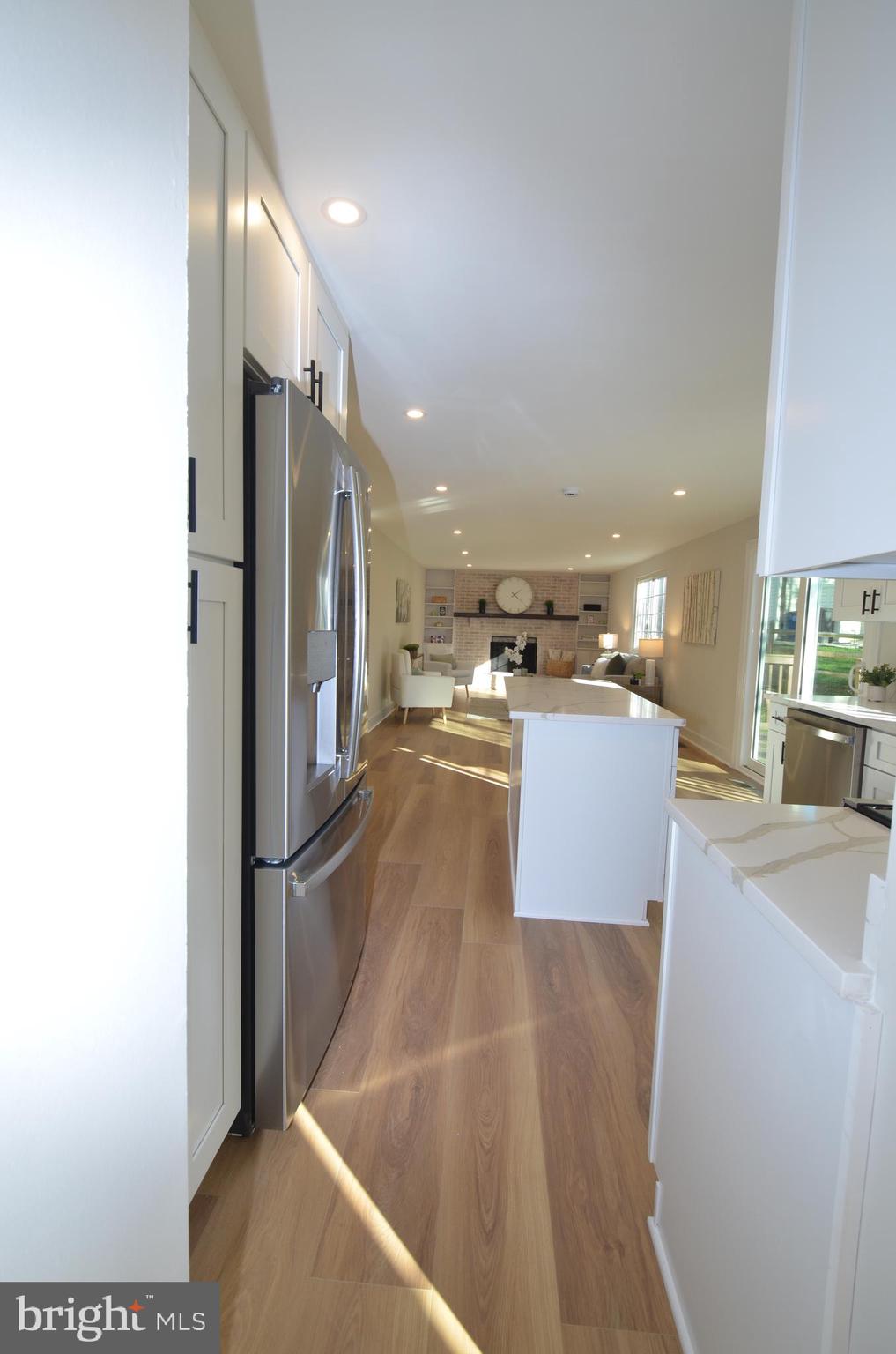 8375 Magic Leaf Road Springfield, VA 22153 - Photo 29 of 43 a view of a kitchen with cabinets and stainless steel appliances