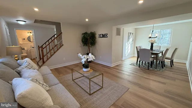 a view of a livingroom with furniture and wooden floor