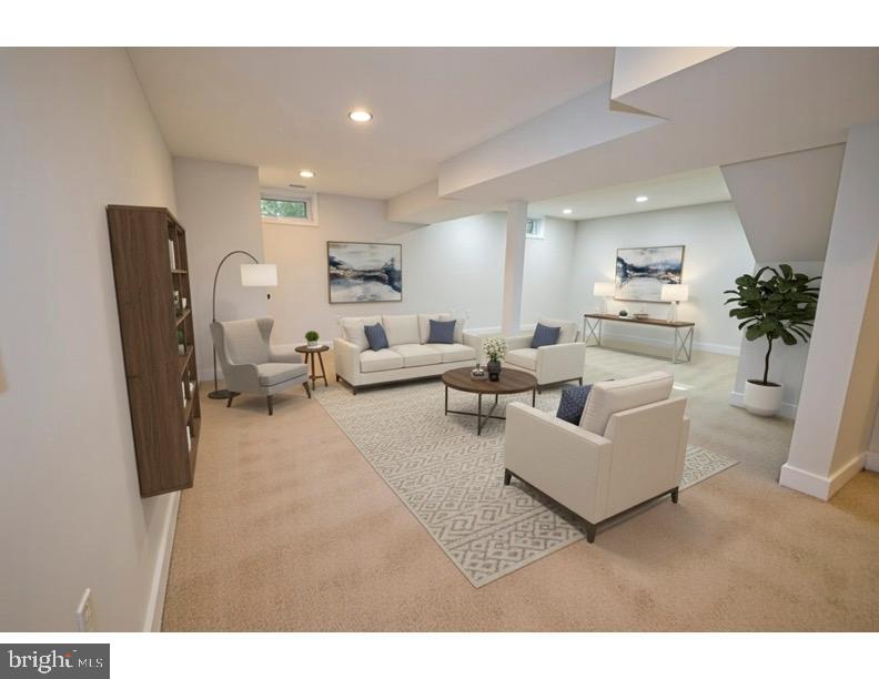 8375 Magic Leaf Road Springfield, VA 22153 - Photo 36 of 43 a living room with furniture and a potted plant