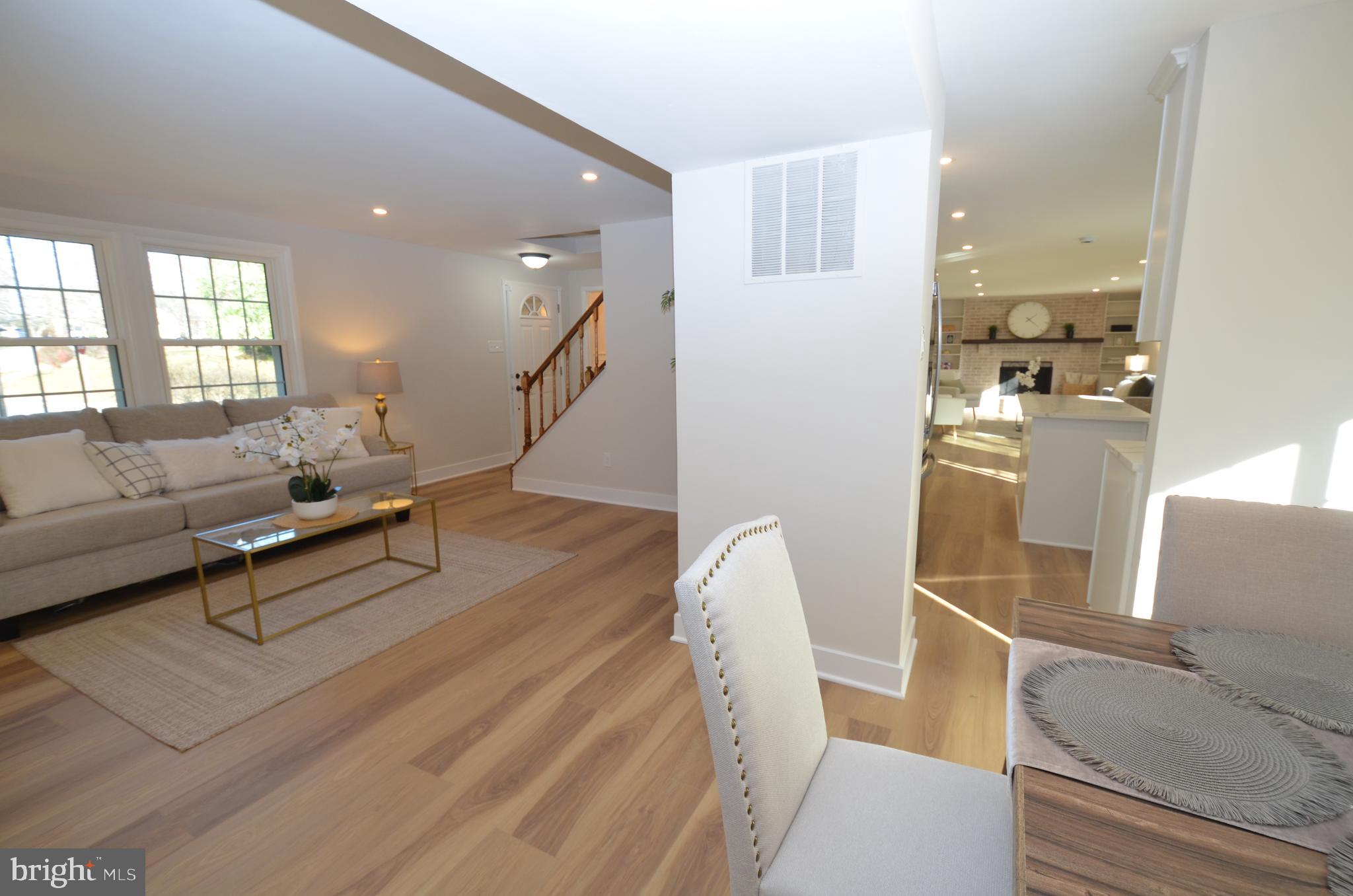 8375 Magic Leaf Road Springfield, VA 22153 - Photo 4 of 43 a living room with furniture and a table
