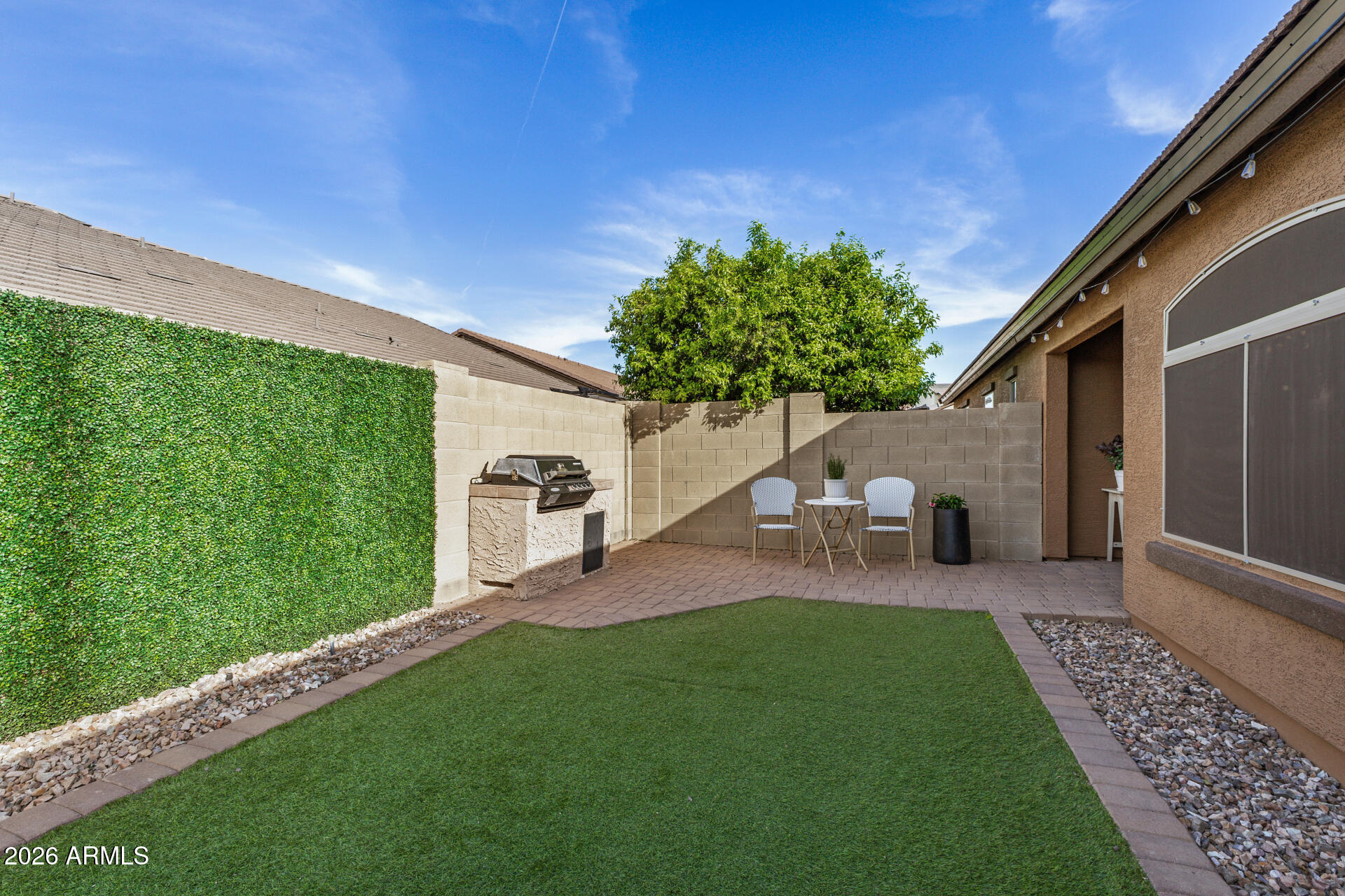 2725 East Mine Creek Road, Unit 1101 Phoenix, AZ 85024 - Photo 30 of 43 a couple of table and chairs in the yard