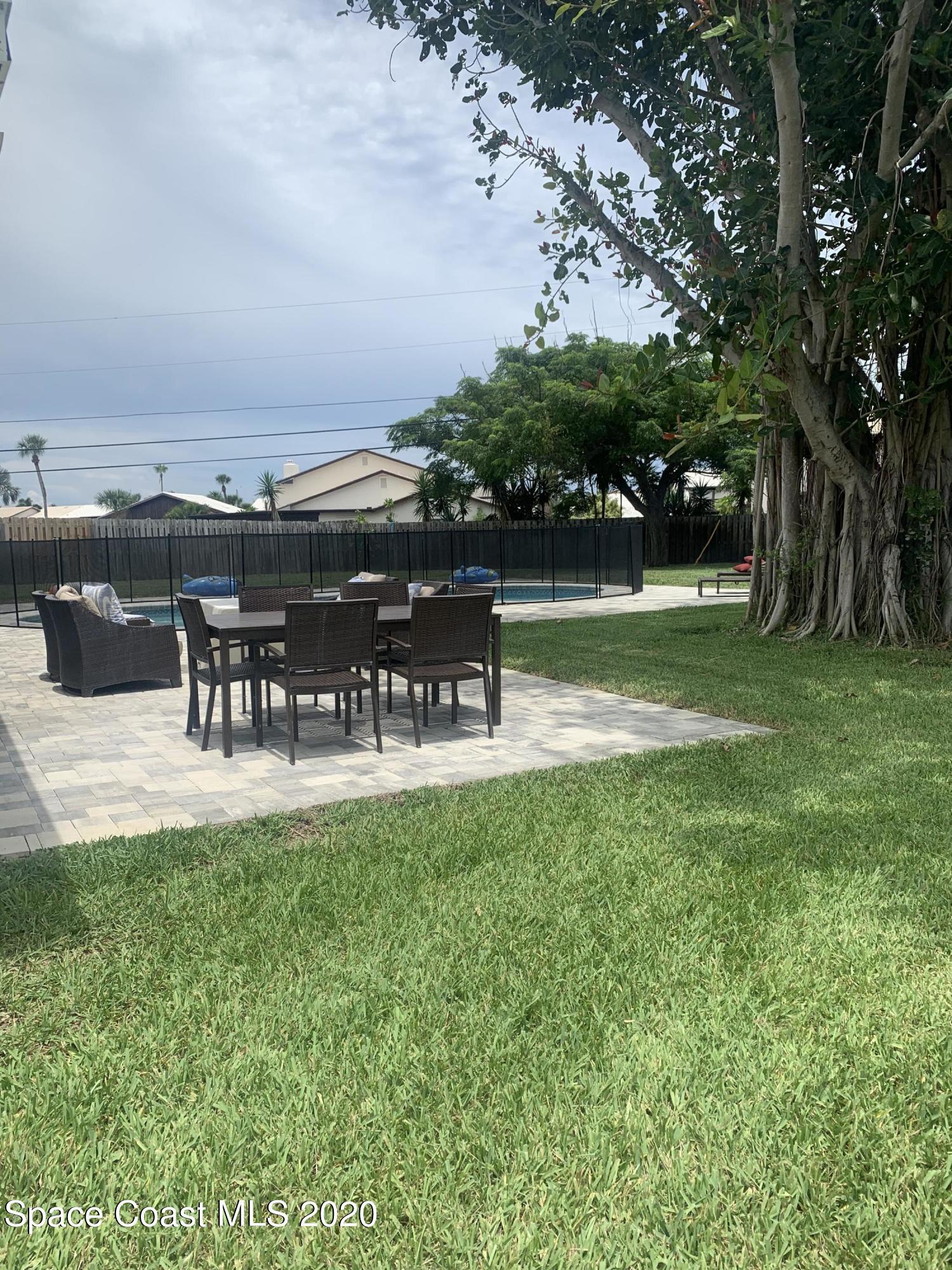 120 Maple Drive Satellite Beach, FL 32937 - Photo 8 of 13 a view of a garden and patio
