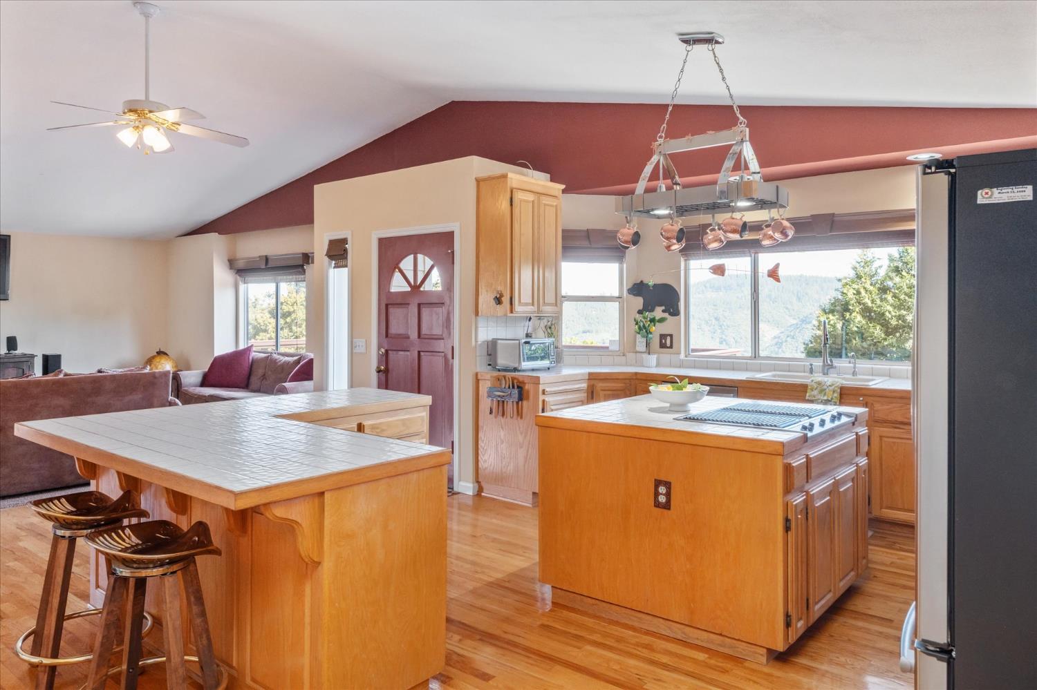4480 Foster Court Murphys, CA 95247 - Photo 13 of 57 The great room opens to a kitchen loaded with stainless appliances -- party-size fridge, trash compactor, instant hot tap, super quiet disposal, and hardwood floors throughout the kitchen and dining areas.