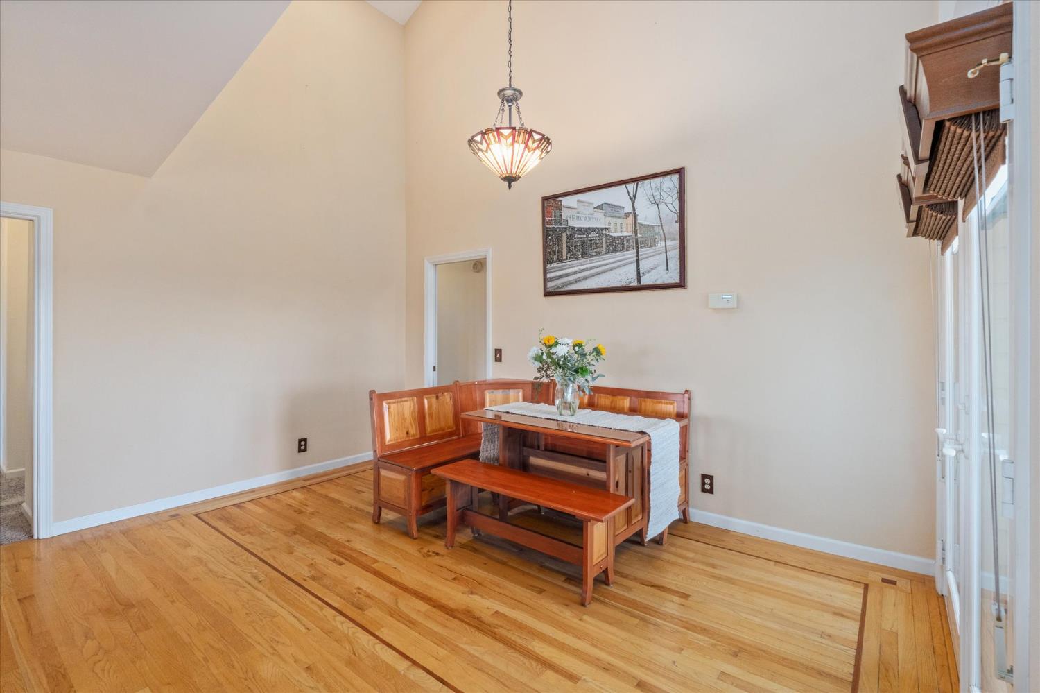 4480 Foster Court Murphys, CA 95247 - Photo 14 of 57 Open floor dining room flows from the kitchen. Cathedral ceilings and hardwood flooring, plus sliders to back deck for seamless entertaining.