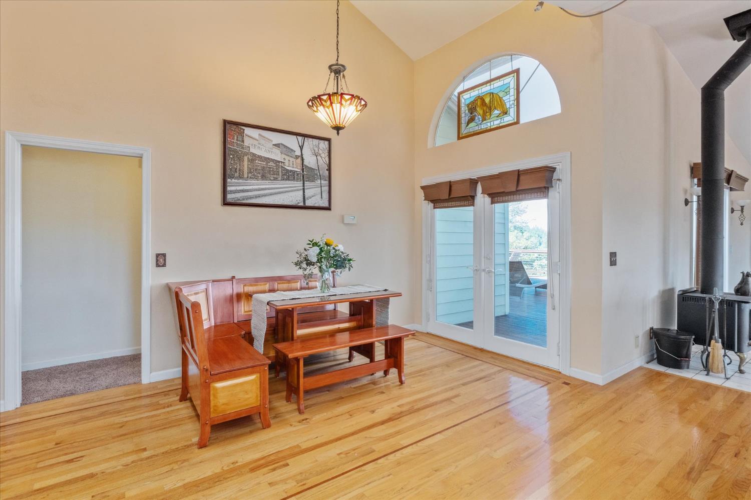 4480 Foster Court Murphys, CA 95247 - Photo 15 of 57 Open floor dining room flows from the kitchen. Cathedral ceilings and hardwood flooring, plus sliders to back deck for seamless entertaining.