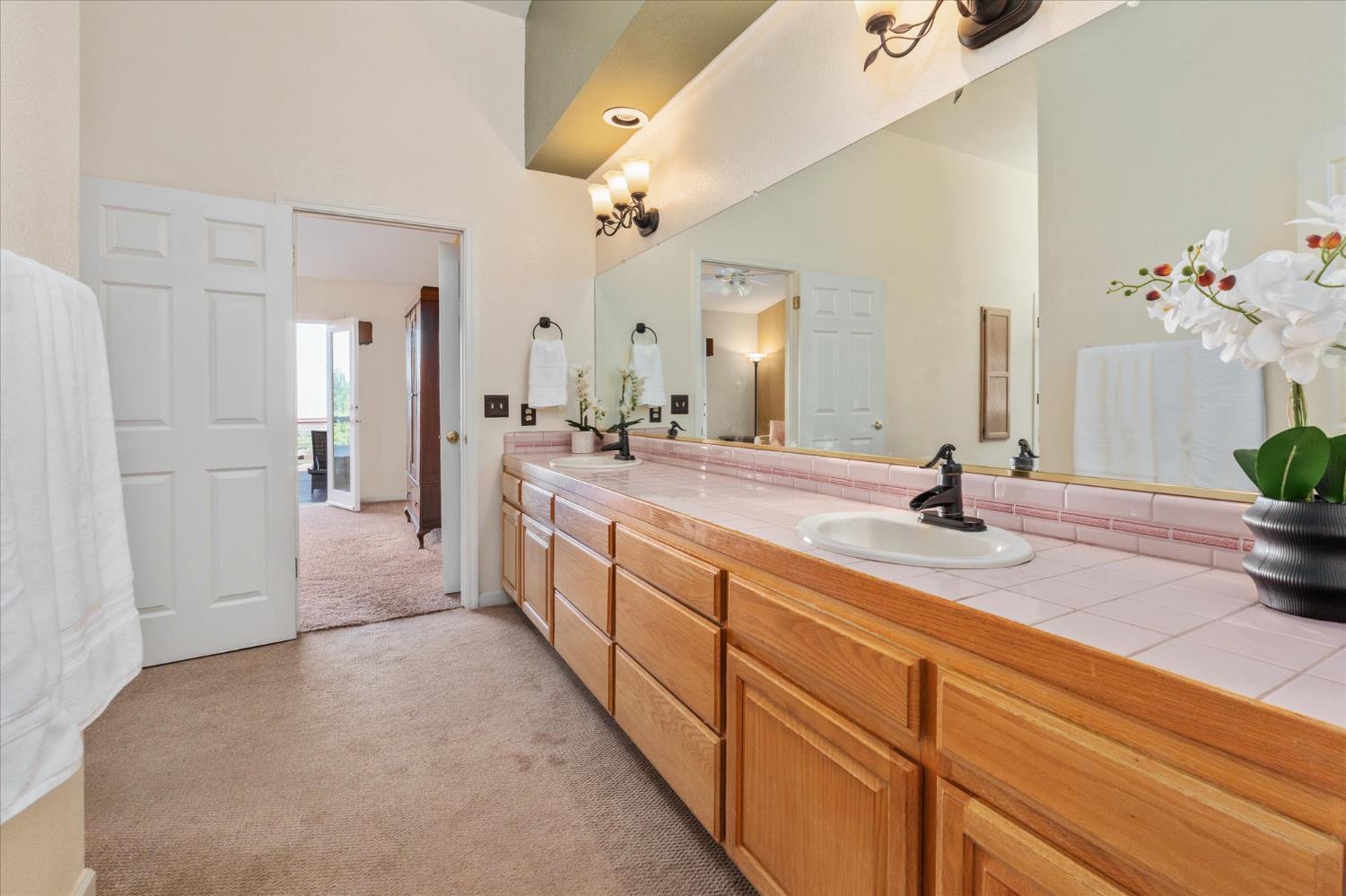 4480 Foster Court Murphys, CA 95247 - Photo 25 of 57 Primary bathroom features dual sinks.