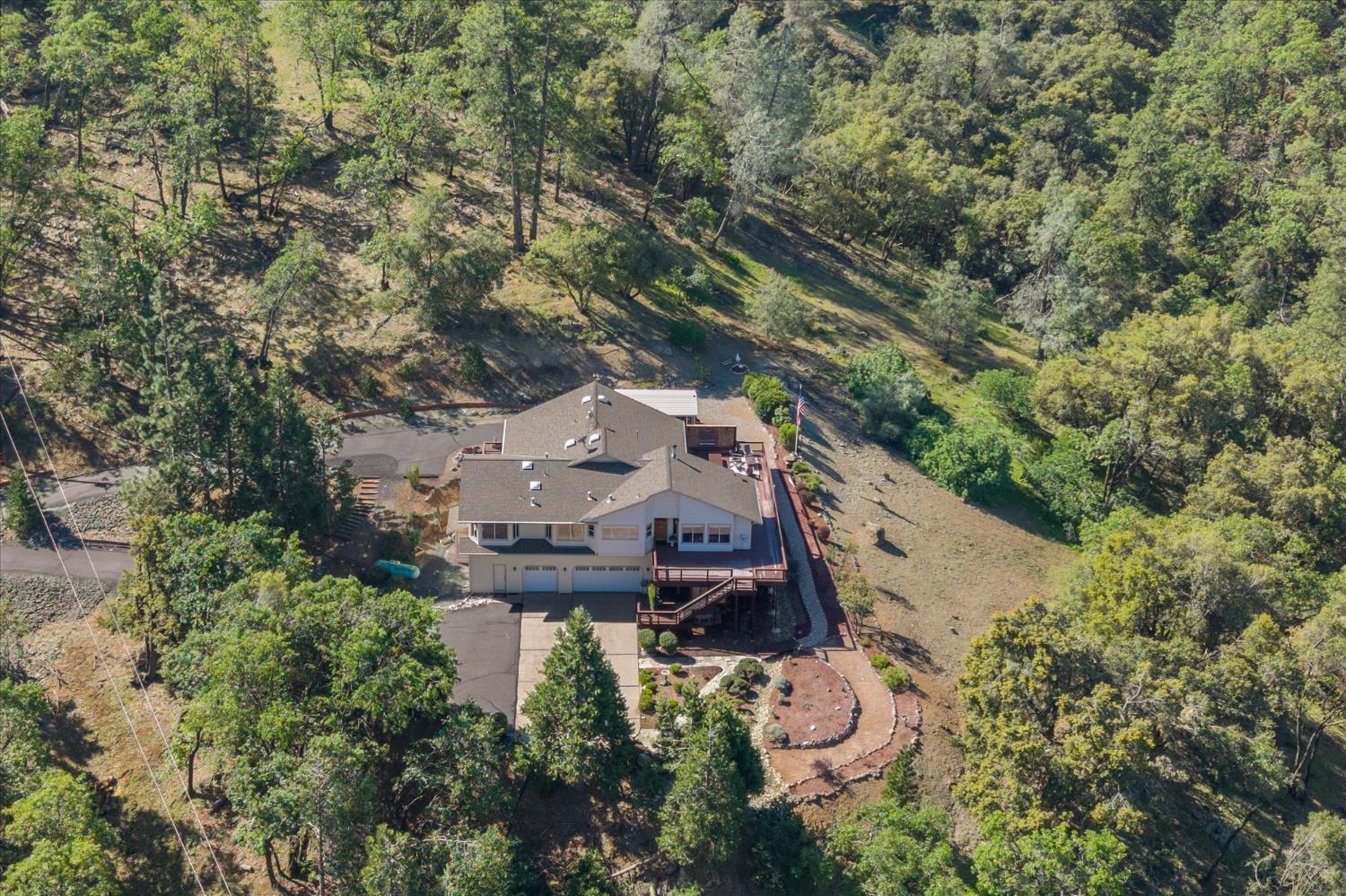 4480 Foster Court Murphys, CA 95247 - Photo 46 of 57 Infrastructure sets this property apart: generator room wired to power 2/3 of the home, new water mainline (October 2023), 2,500-gallon storage tank with fire department hookup, conduit to the front gate for a future powered entry, septic pumped 2023, driveway sealed 2021.