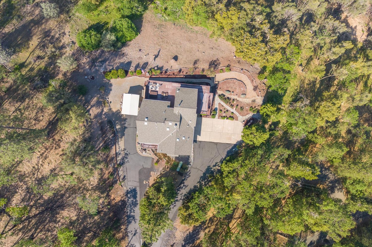 4480 Foster Court Murphys, CA 95247 - Photo 48 of 57 Infrastructure sets this property apart: generator room wired to power 2/3 of the home, new water mainline (October 2023), 2,500-gallon storage tank with fire department hookup, conduit to the front gate for a future powered entry, septic pumped 2023, driveway sealed 2021.