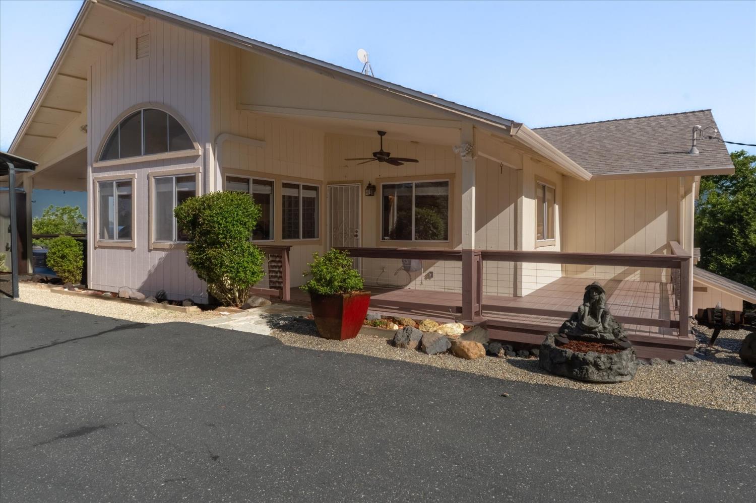 4480 Foster Court Murphys, CA 95247 - Photo 4 of 57 Level-in rear access to the main living area. Features a massive paved wrap-around driveway with ample parking.