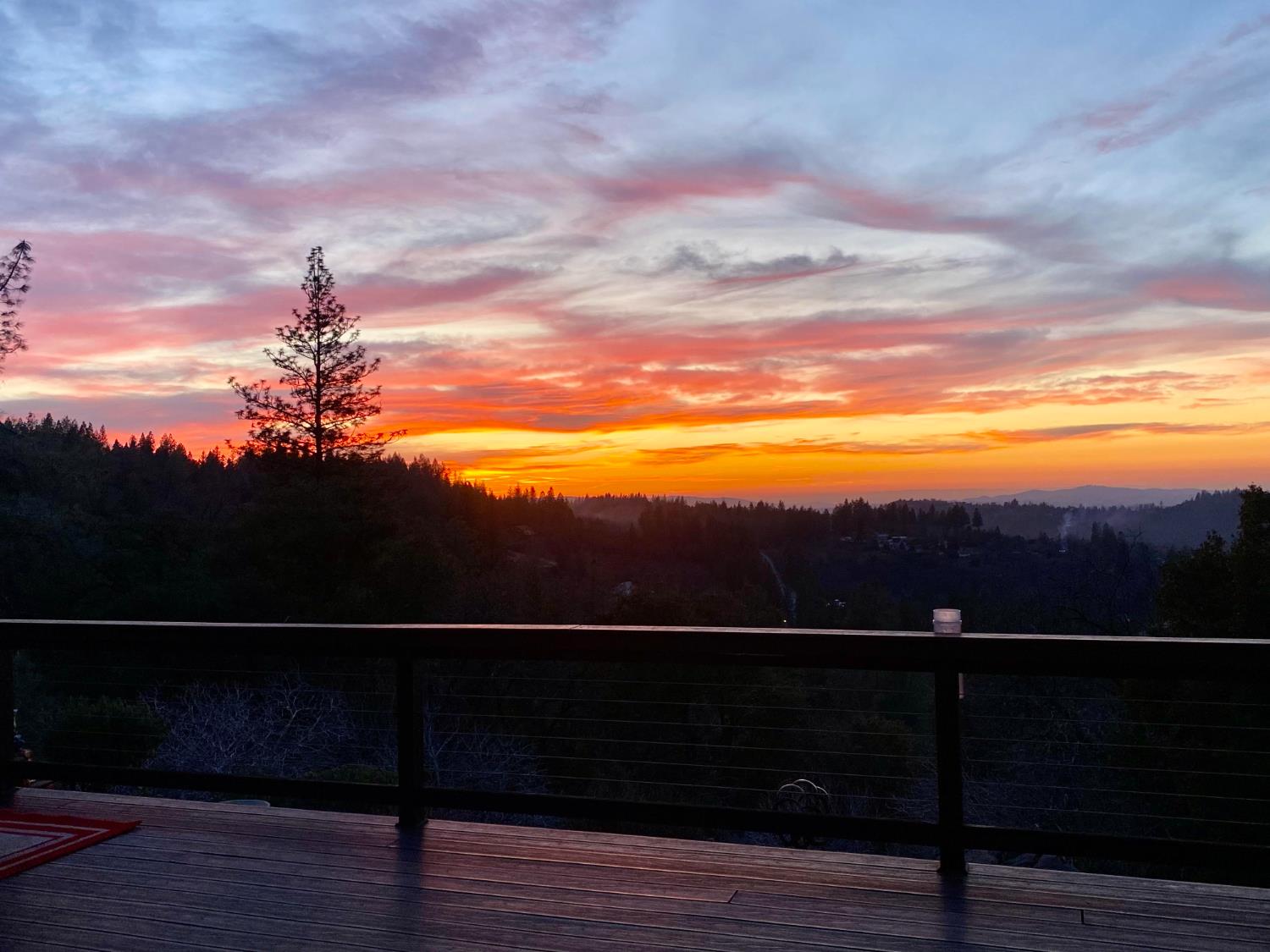 4480 Foster Court Murphys, CA 95247 - Photo 52 of 57 Epic sunsets from your deck!Entertainment Decking: Dual wraparound composite decks with modern stainless-steel cable railings designed for low-maintenance sunset viewing.