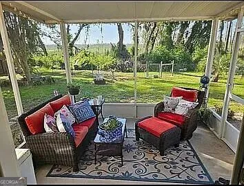 a view of a patio with couches chairs and a table