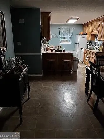 a kitchen with sink cabinets and stove