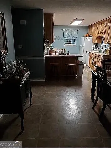 a kitchen with sink cabinets and stove